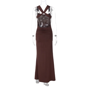 Detail view of the backless cross-strap design and ruched detail on a slim fit maxi dress