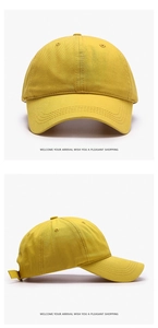 Detail view of yellow cotton baseball cap with curved brim and reinforced stitching