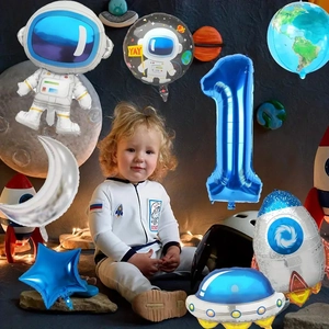 Space party decor set featuring astronaut foil balloons and rockets for 1st birthdays