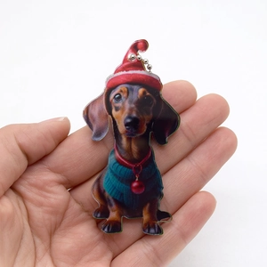 Acrylic Dachshund hanging ornament with Christmas hat and green sweater for holiday decor