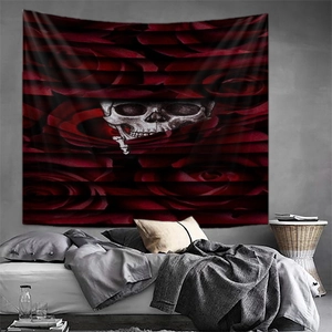 Gothic style mandala tapestry with red roses and white skulls on industrial wall