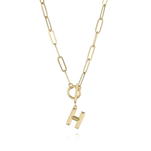 Close-up of gold paperclip chain necklace with H pendant and toggle clasp