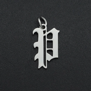 Close-up of polished silver stainless steel hollow letter P pendant with top jump ring
