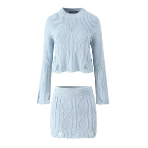 Detailed view of light blue cable knit two-piece set with hollow out distressed finish