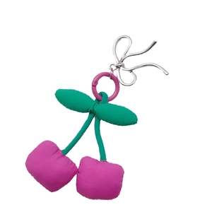 Handmade cherry bow pendant with pink fabric plush charms and silver keychain hook