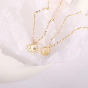 Detail of 14K gold plated celestial necklace set with sun and moon pendants