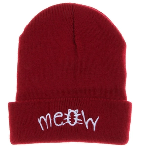 Close-up of ribbed burgundy knit beanie featuring white meow embroidery and cat face pattern