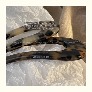 Close-up of handmade tortoiseshell acetate U-shaped hair fork pins in 13.5cm length