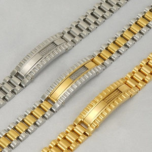 Macro detail of stainless steel men's watch-style bracelet with 18K gold and silver plating