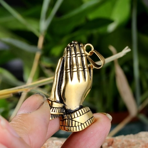 Golden praying hands pendant in polished titanium steel for trendy streetwear fashion