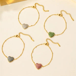 Detail showing four 18k gold plated stainless steel heart bracelets with multi-color rhinestones