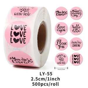 Roll of 500 pink Valentine's stickers showing 8 unique romantic text designs