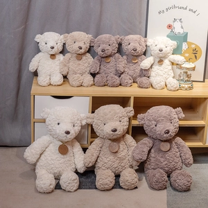 Collection of plush bear dolls in white, beige and brown colors for gift decoration
