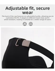 Detail of black baseball cap showing the adjustable matte metal buckle and strap