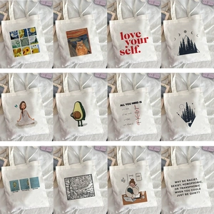 Collage of 12 beige canvas tote bags featuring artistic prints and typography designs