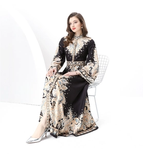 Detail view of the vintage floral paisley print and stand collar on this long dress
