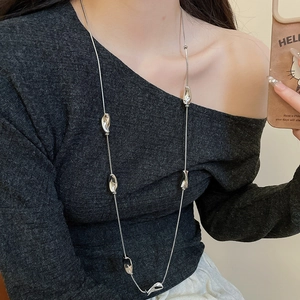 Silver liquid metal irregular square pendant long chain necklace on dark top