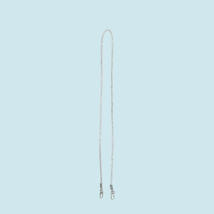 Detail of a sparkling silver rhinestone strap with durable metal lobster clasps for bags