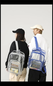 Macro detail of waterproof transparent PVC backpacks with grey and blue trim finishes
