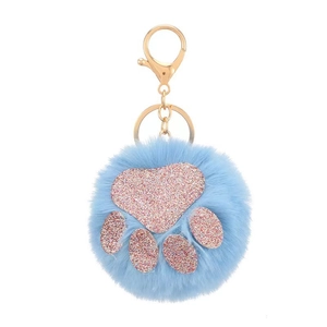 Detail of sky blue faux fur ball keychain with pink sequin cat paw and gold clasp