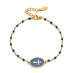 Macro detail of stainless steel cross pendant and blue beads on a golden chain