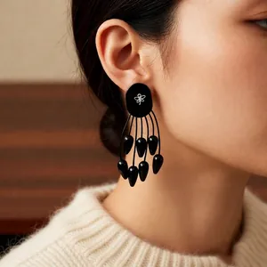 Boucles d'oreilles ethniques à pampilles noires avec papillon en argent et bois