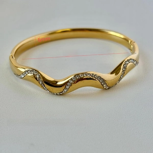 18K gold plated stainless steel wavy bangle with crystal inlay, 60mm diameter
