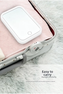 Portable square LED makeup mirror with touch switch packed in a travel suitcase