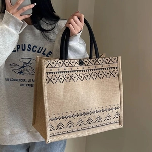 Minimalist beige jute tote bag with ethnic geometric patterns and durable handles