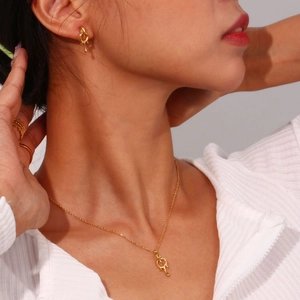 Minimalist 18K gold plated stainless steel jewelry set with lava pendant and earrings