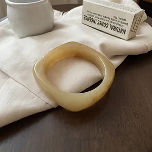 Minimalist amber resin geometric square bangle with vintage translucent cloudy texture