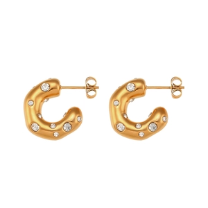 Fashionable 18K gold plated C-shaped earrings with sparkling cubic zirconia on white background