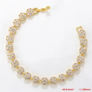 Detail view of flower cluster gold chain bracelet with white cubic zirconia stones