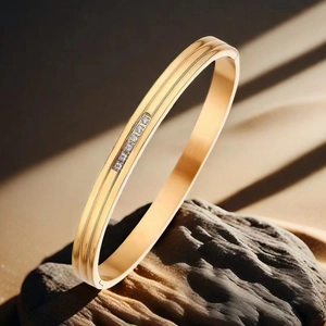 Close-up of gold double-line stainless steel bangle with six inlaid sparkling zircons