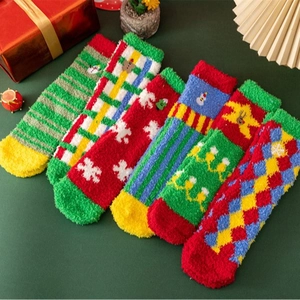 Cozy Christmas coral fleece socks set with snowflake and reindeer patterns in gift box
