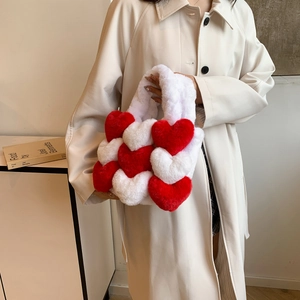 Detail of red and white plush heart tote bag with soft texture and patchwork design