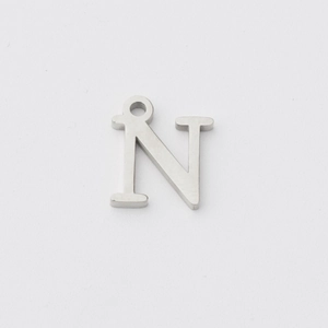 Macro shot of mirror-polished stainless steel capital letter N pendant for DIY necklaces