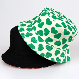 Double-sided reversible bucket hat with heart print and solid black canvas design