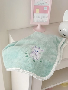 Detail of mint green coral fleece towel with white lamb embroidery and twisted rope edge