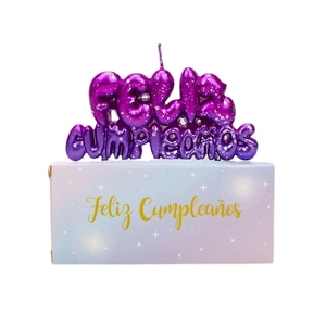 Sparkly purple galaxy starry sky birthday candle with Feliz Cumpleaños text and packaging