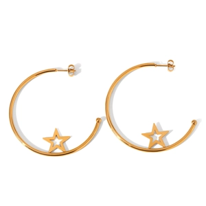 Detail view of large gold-tone C-shaped hoop earrings featuring hollow star ornaments