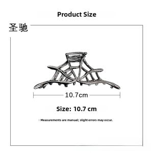 Detailed close-up of a 10.7cm gun-grey alloy spider web hair claw clip on white background