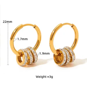 Gold stainless steel hoop earrings with crystal pavé and polished charms, 22mm diameter