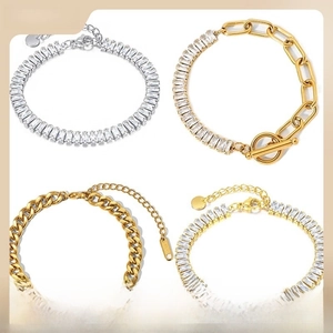 Detailed view of gold and silver tennis bracelets with cubic zirconia and T-bar toggles