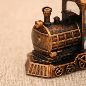 Close-up of vintage bronze locomotive decorative lamp with brushed metal texture