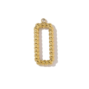Detailed view of a gold geometric twisted rectangle pendant with high-gloss finish
