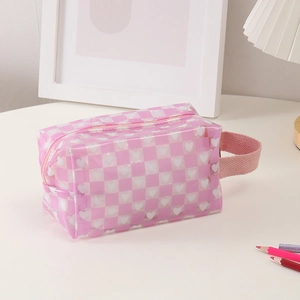 Detail of pink checkerboard stationery pouch with heart patterns and side carry handle