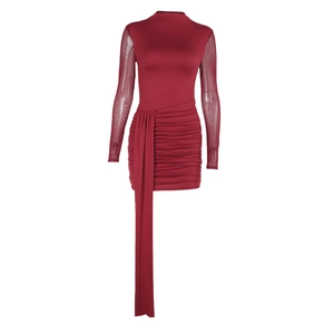 Slim fit wine red dress with mesh sleeves and side drape details in a front view