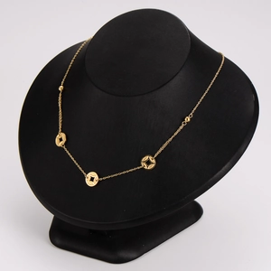 Gold Chinese coin necklace with multiple round pendants on a black neck bust model