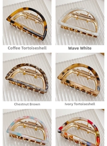 Detailed grid of six half-round claw clips in marble and tortoiseshell patterns